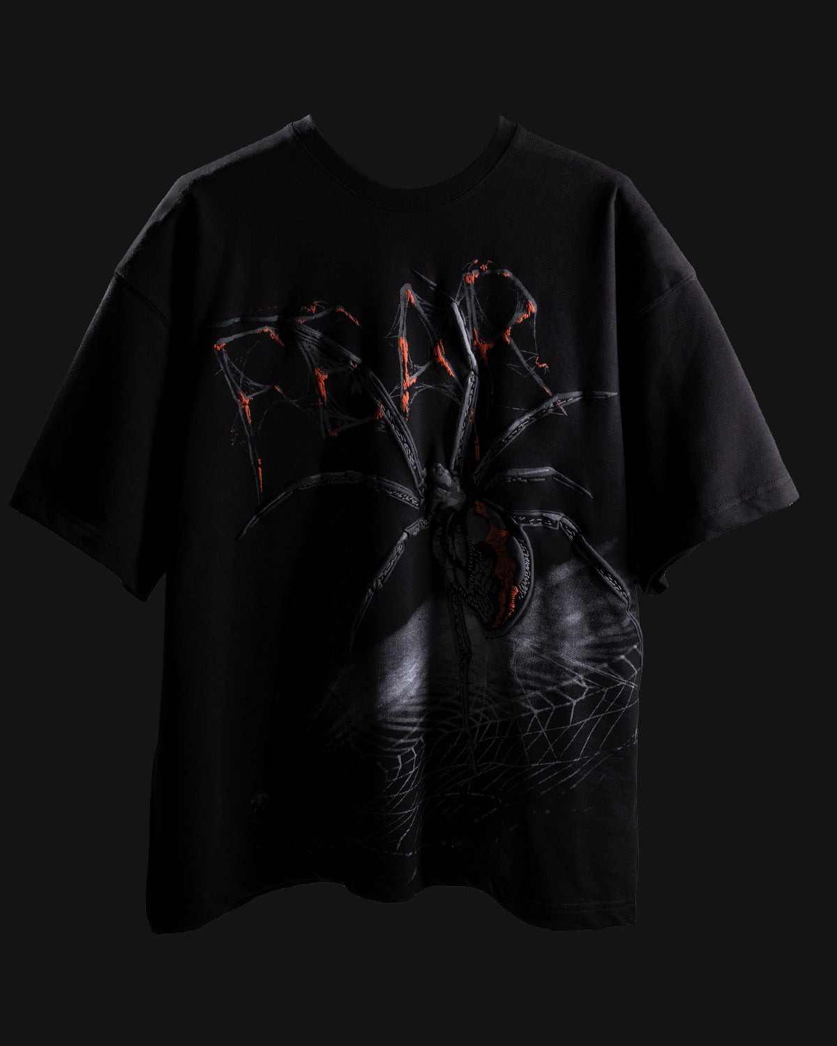 Black t-shirt with a spider graphic on a black background