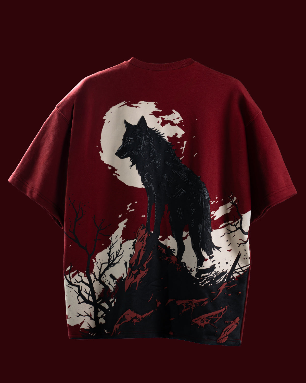 Red t-shirt with a black wolf graphic on a dark red background