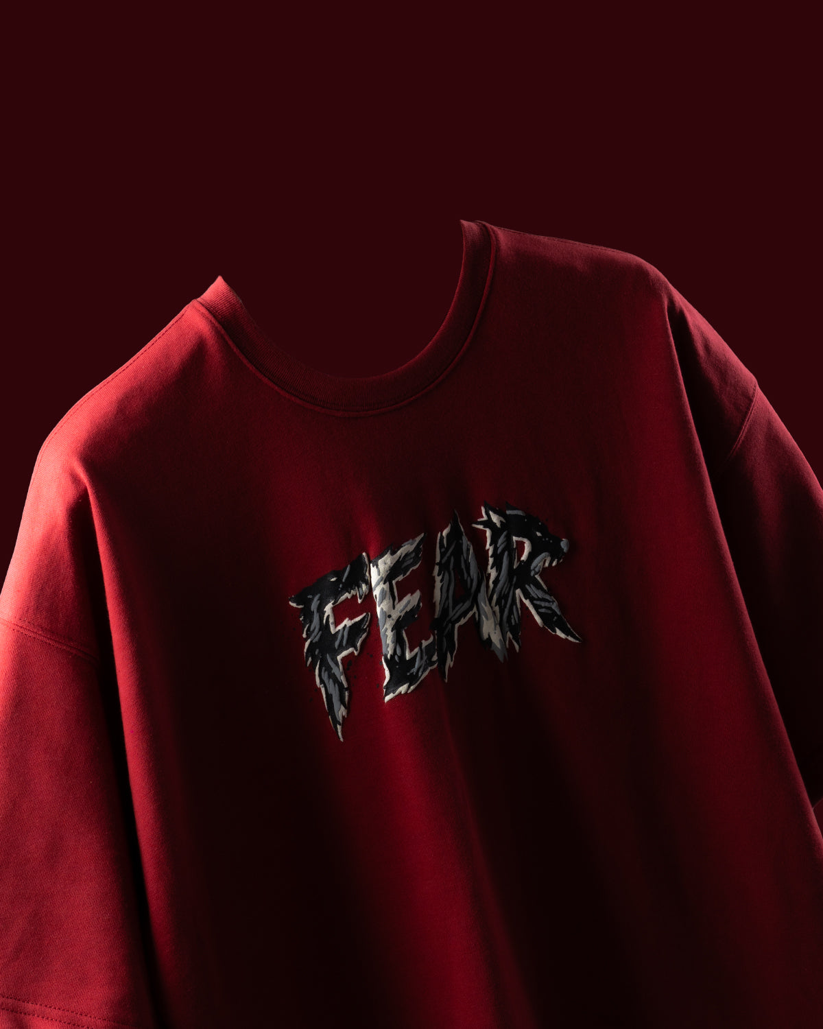 Red t-shirt with 'FEAR' text.